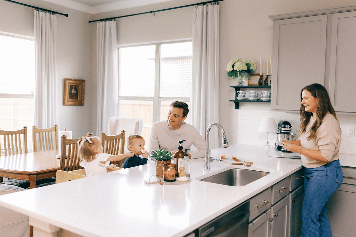 Happy family cooking together in a Betenbough home kitchen