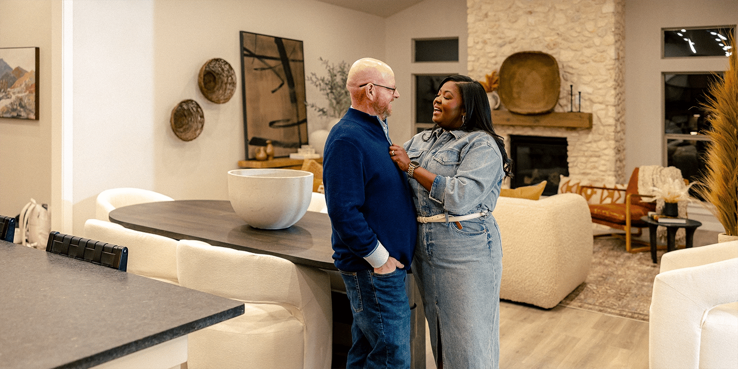 Couple smiling at each other in living room