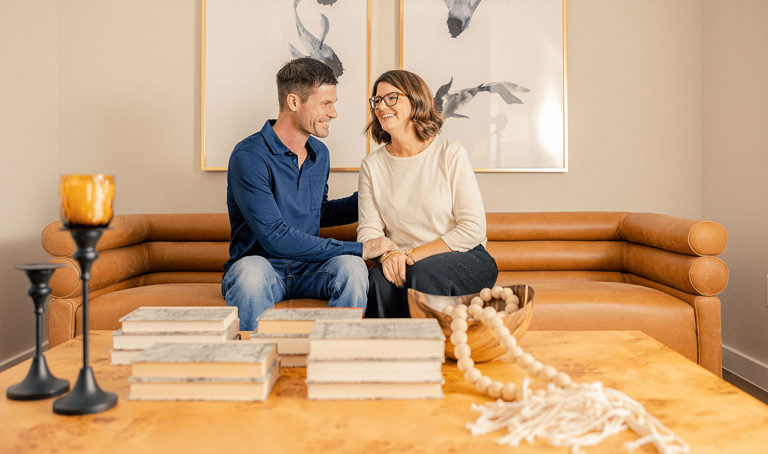 Couple laughing together on couch