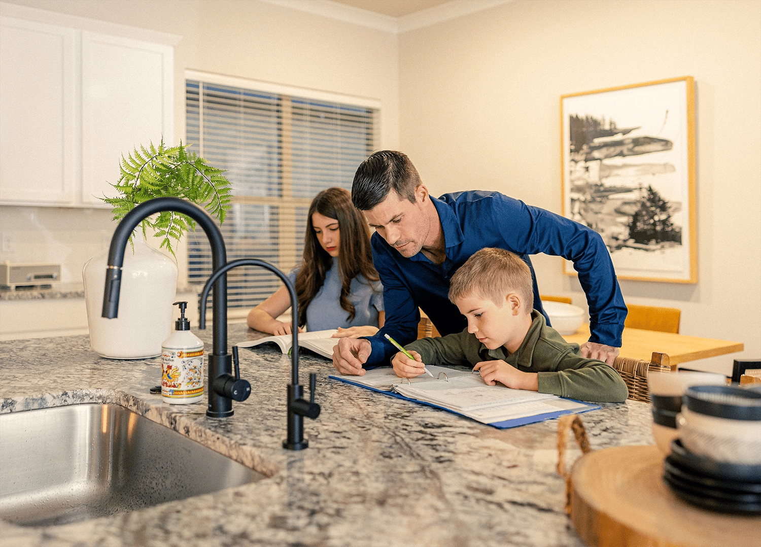 Dad helping his kids with homework