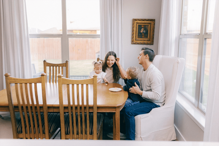 Couple sitting in their Betenbough home dining room