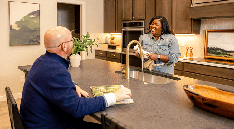 Family smiling together in kitchen