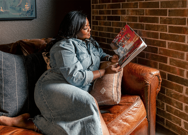 Woman reading her book on couch