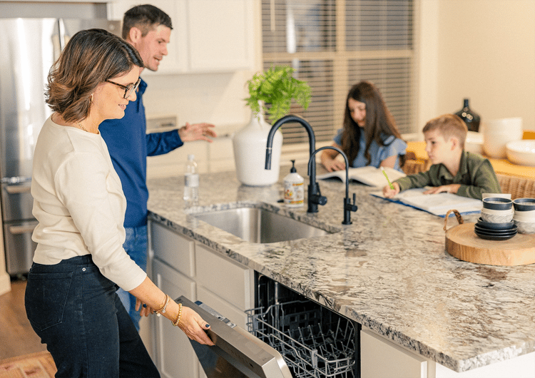 Family hanging out in their kitchen