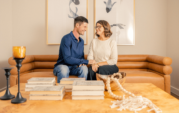 Happy couple sitting on a couch