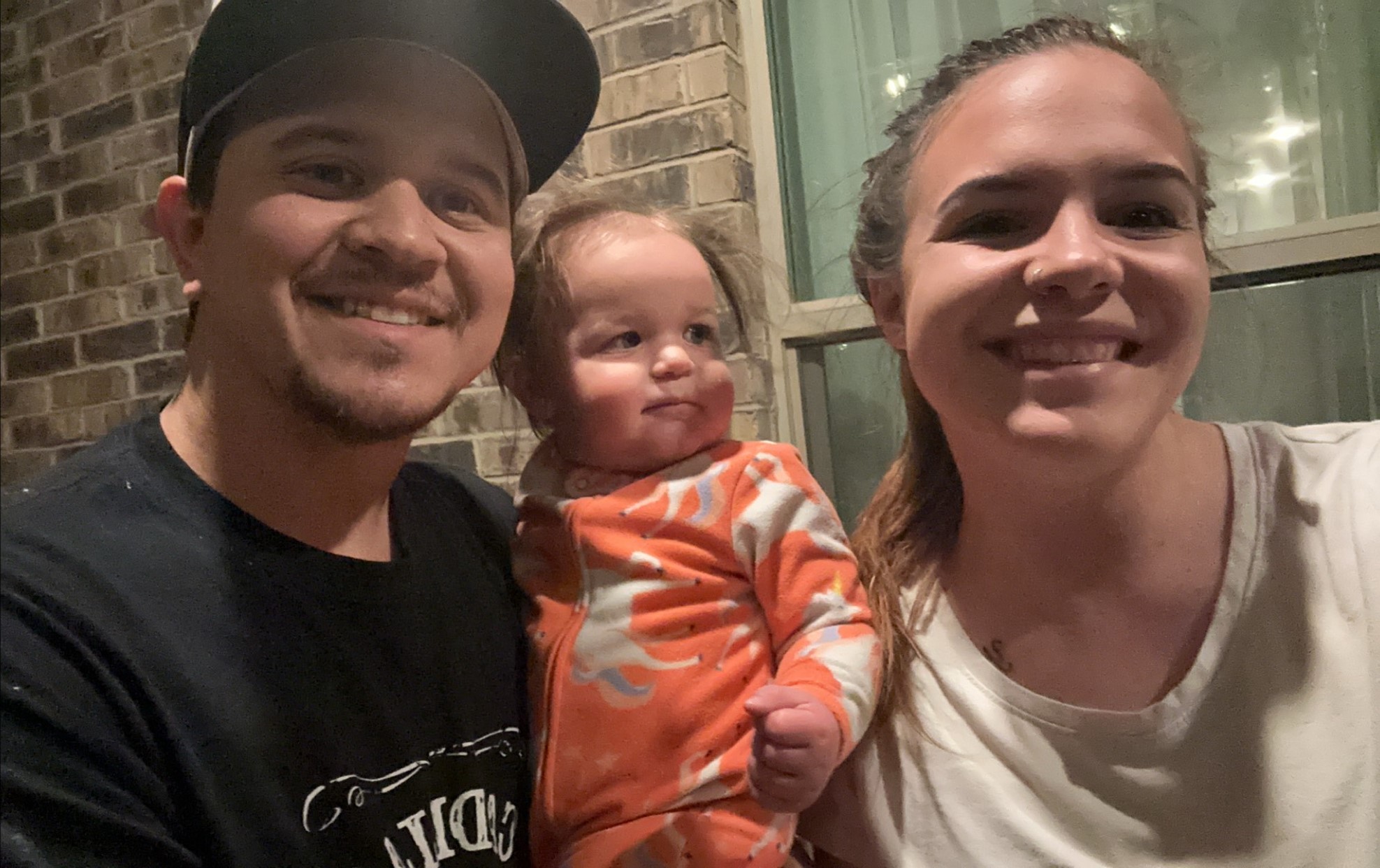 Photo of Payton, her husband, and their daughter.