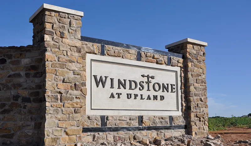 Photo of the community sign at the Betenbough Homes community "Windstone at Upland."