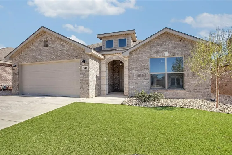 Photo of exterior of a West Texas Betenbough home with beautiful landscaping.