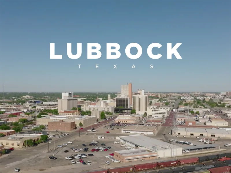 Arial photo of Lubbock, Texas with text "Lubbock, Texas" over the photo.