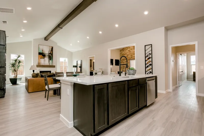 Photo of a furnished and decorated kitchen, living area, and bonus room in a Betenbough home.