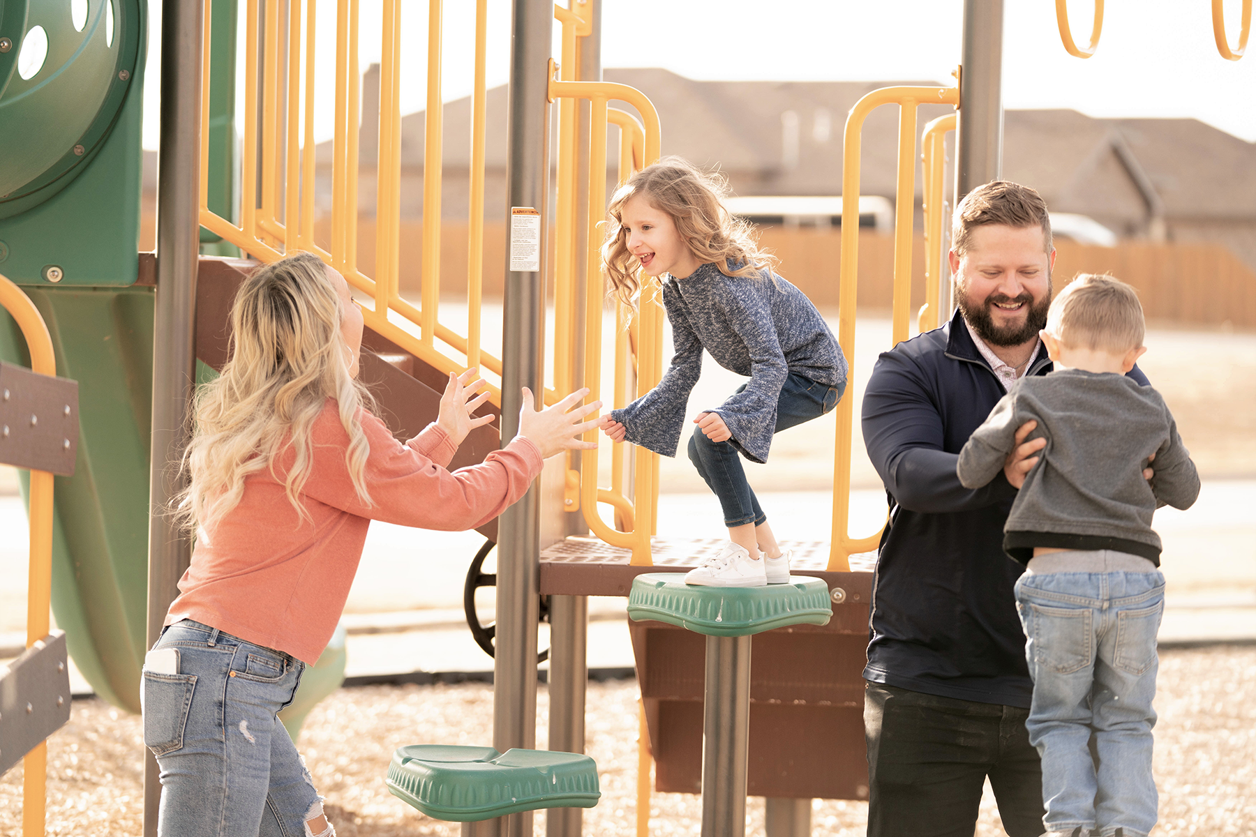 Photo of a family playing in a community park.