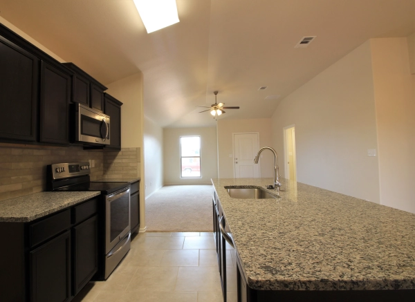 Photo of the Brenna floor plan kitchen and living area.