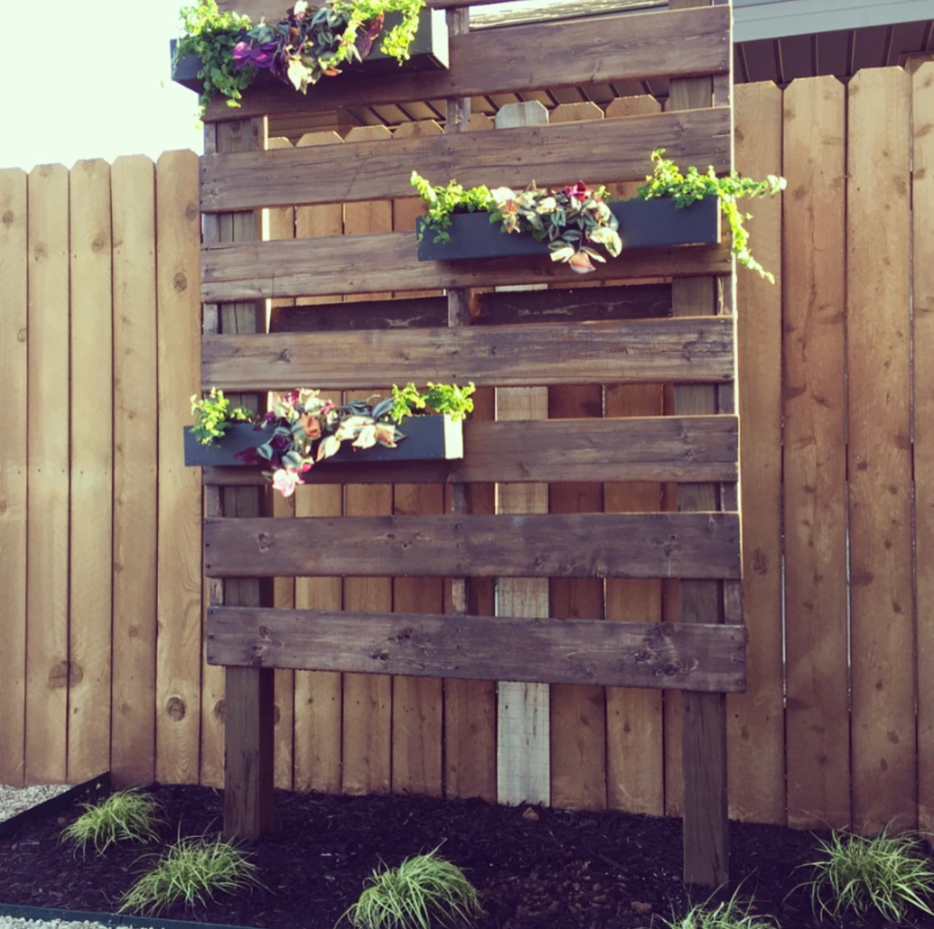 Photo of a DIY home project: a pallet turned into an outdoor planter.