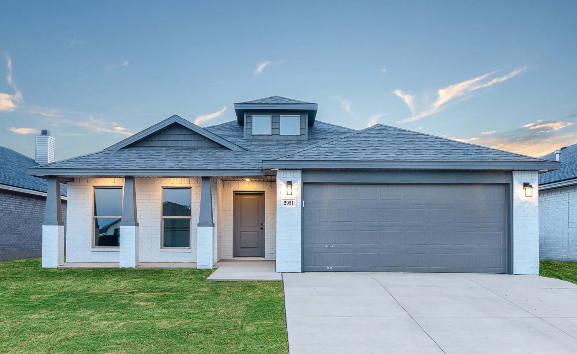 Photo of Betenbough Homes' Pamela floor plan with a covered front porch and triple columns.