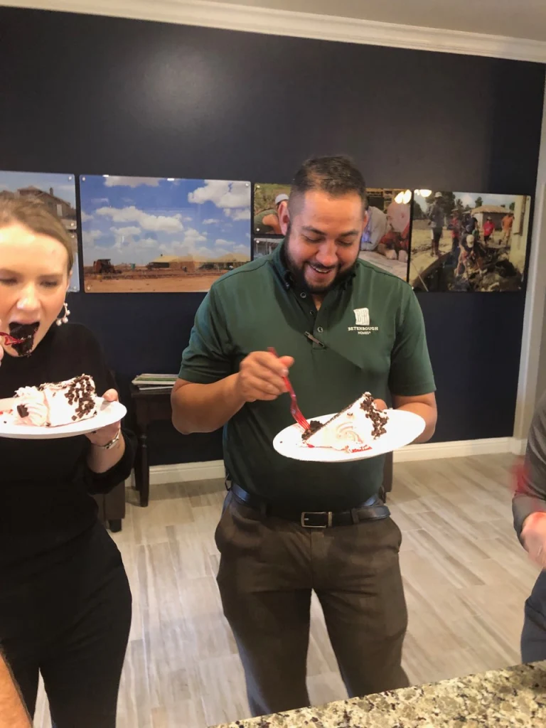 Photo of Odessa team members enjoying their cake.