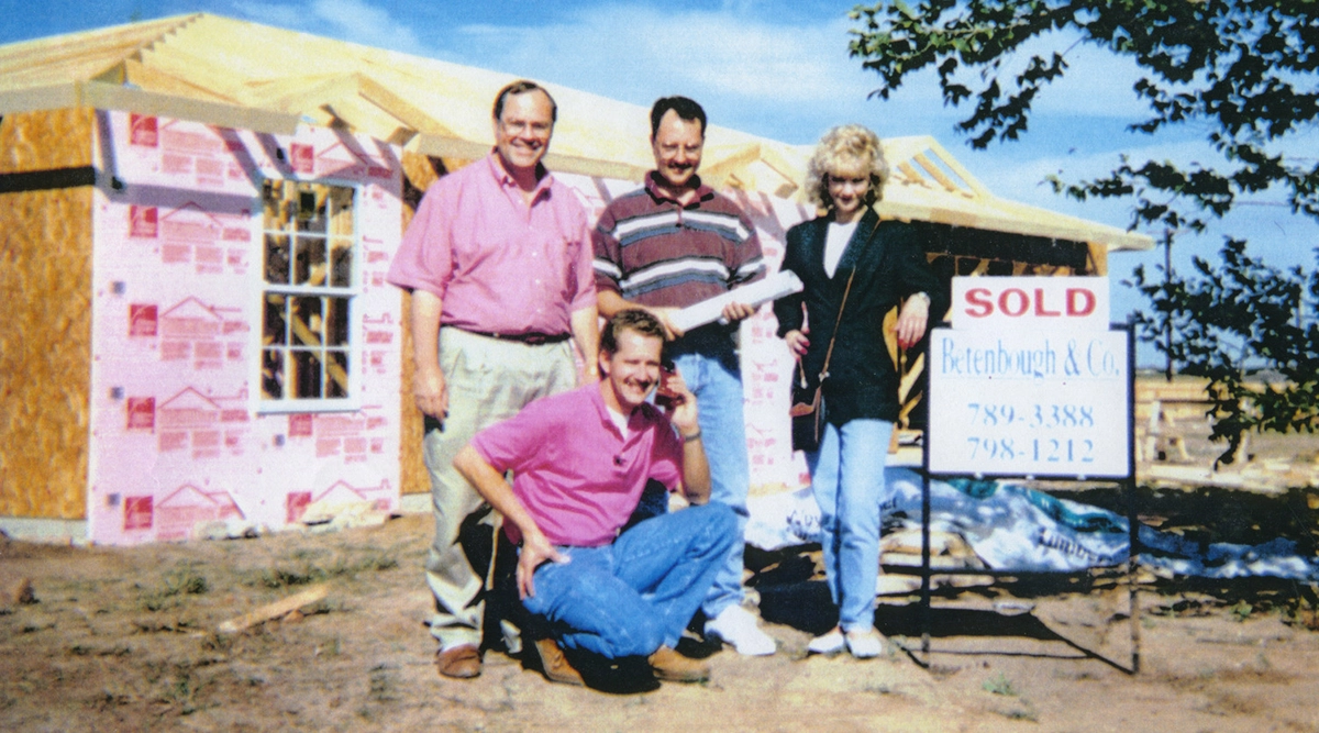 Ron, Sean, Rick and Tohi standing in front of a Betenbough Home under construction with a sold sign out front