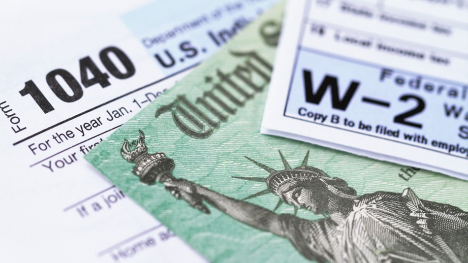 Photo of a Form 1040, a U.S. Treasury note, and a W-2