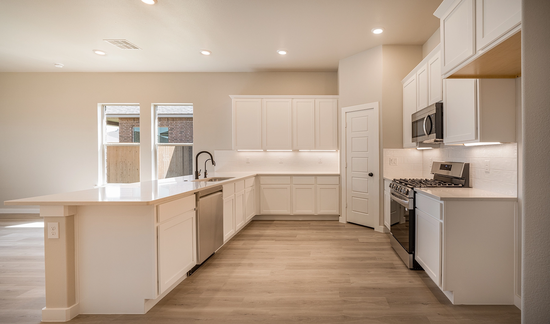 Modern kitchen inside of a new Betenbough home